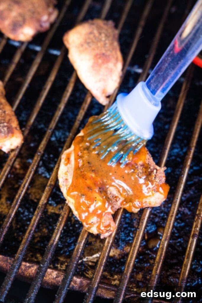 brushing sauce on chicken