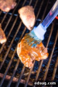 brushing sauce on chicken