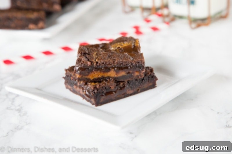 Freshly baked chocolate caramel bars cooling in a pan before slicing.