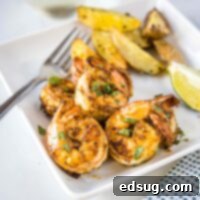 Crispy Air Fryer Shrimp 7 Close up cropped picture of perfectly cooked, seasoned air fryer shrimp, ready to serve.