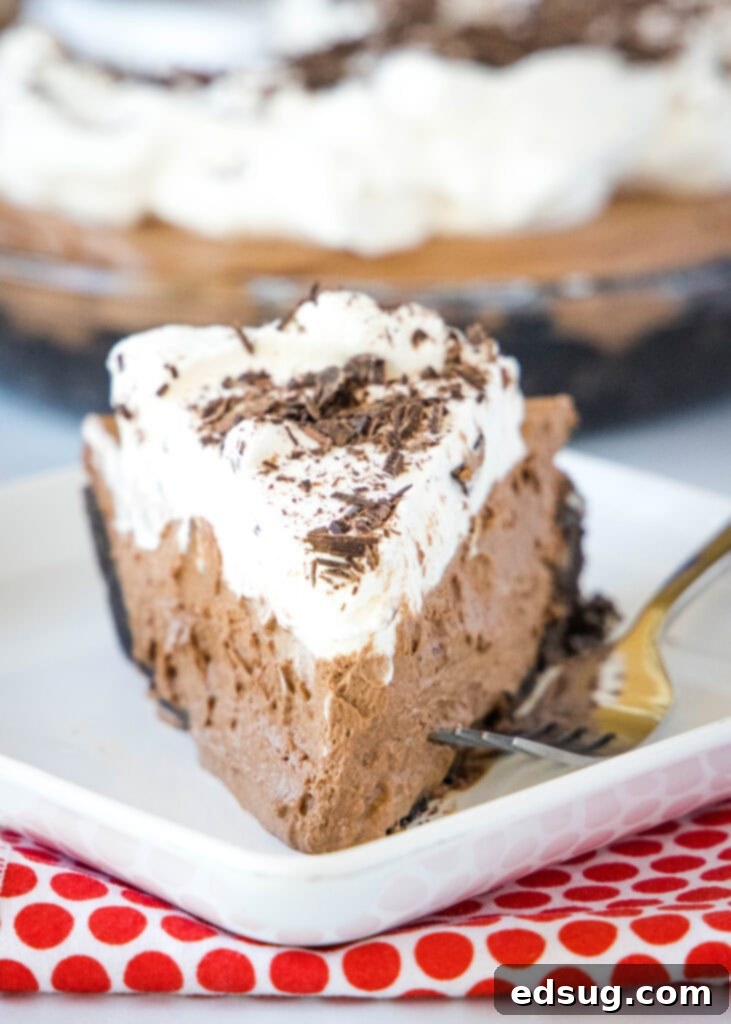 Ultimate Chocolate Indulgence Pie 5 face on slice of death by chocolate cream pie on white plate