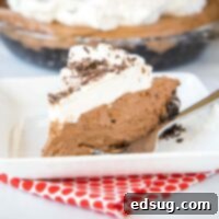 cropped square image of chocolate cream pie on white plate