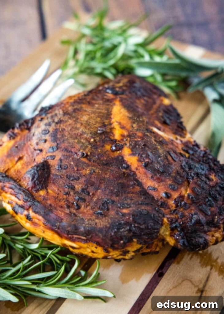 cooked turkey breast on cutting board