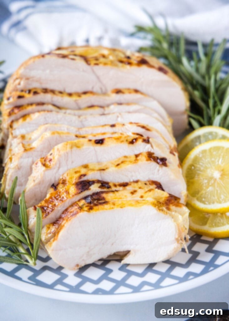 Juicy Sous Vide Turkey Perfection 2 sliced turkey breast on serving plate