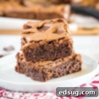 cropped close up of brownies on a white plate