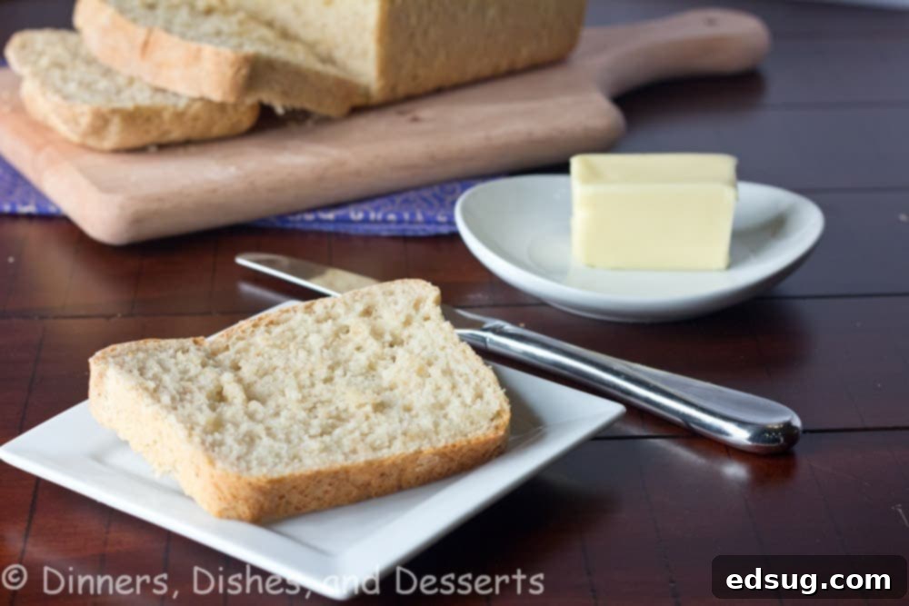 Slices of Classic Oatmeal Bread on a wooden cutting board