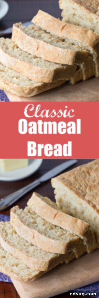 A close-up of a slice of Classic Oatmeal Bread slathered with butter
