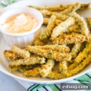 cropped in close up of air fryer green bean fries