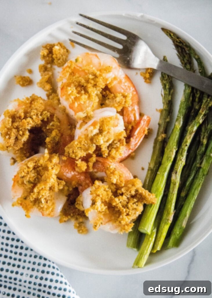 Golden Crispy Shrimp 7 looking down on a plate of crispy shrimp with asparagus