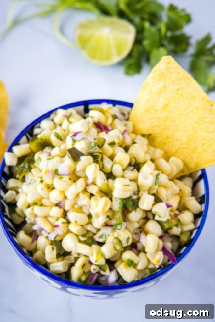 looking down on a blue bowl with chipotle corn salsa