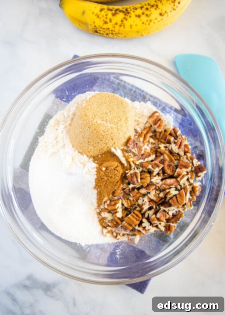 Perfect Banana Nut Muffins 3 dry ingredients for banana nut muffins in a bowl