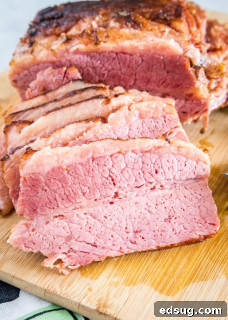 sliced corned beef brisket on a cutting board