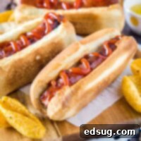 Perfect Air Fryer Hot Dogs 7 cropped in close up of air fryer hot dog with ketchup