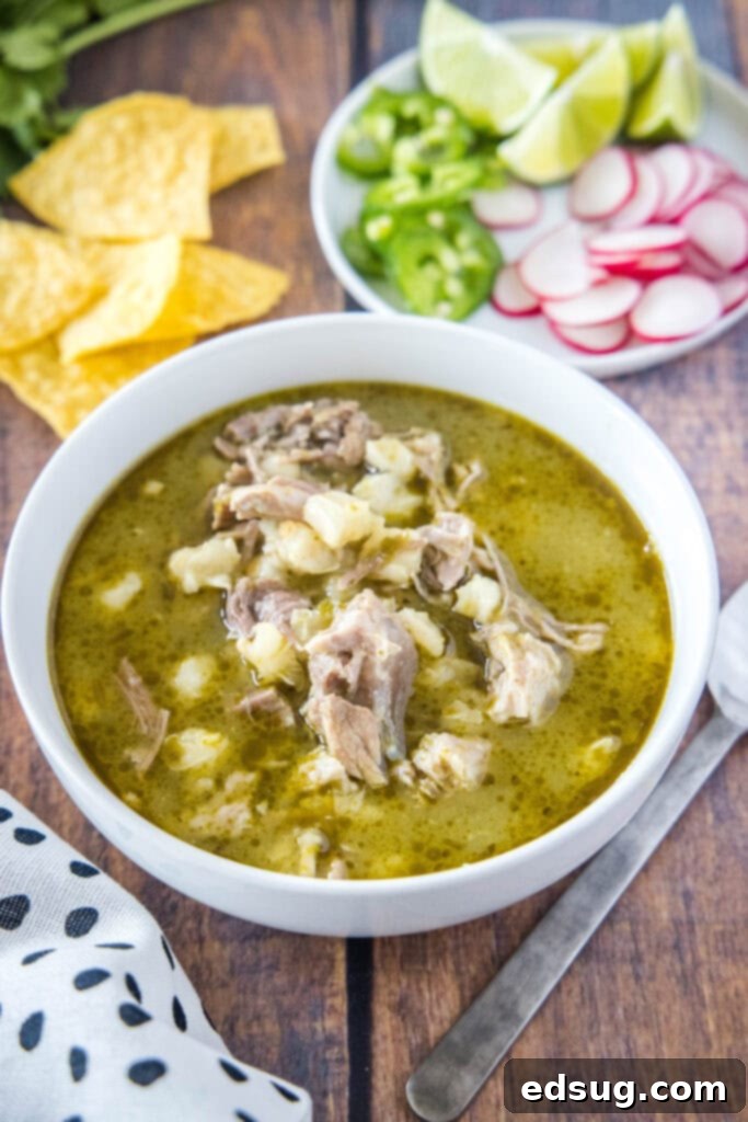 Effortless Instant Pot Pozole 7 bowl of pork pozole in a bowl, garnished and ready to eat