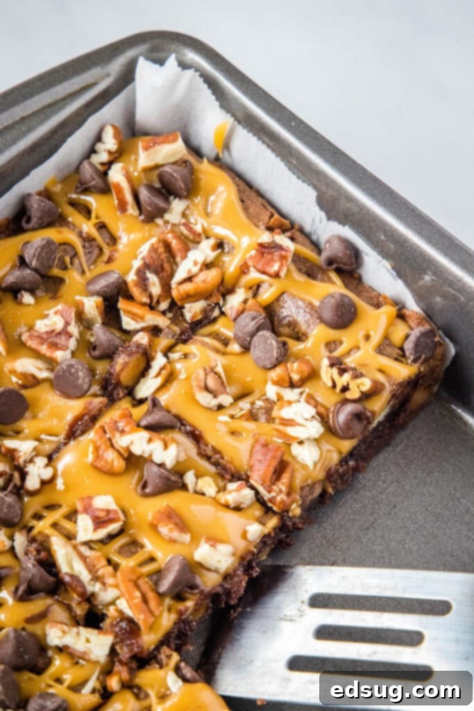 Ultimate Turtle Brownies 4 sliced turtle brownies in pan