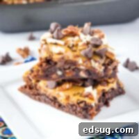 close up stacked brownies with pecans and caramel