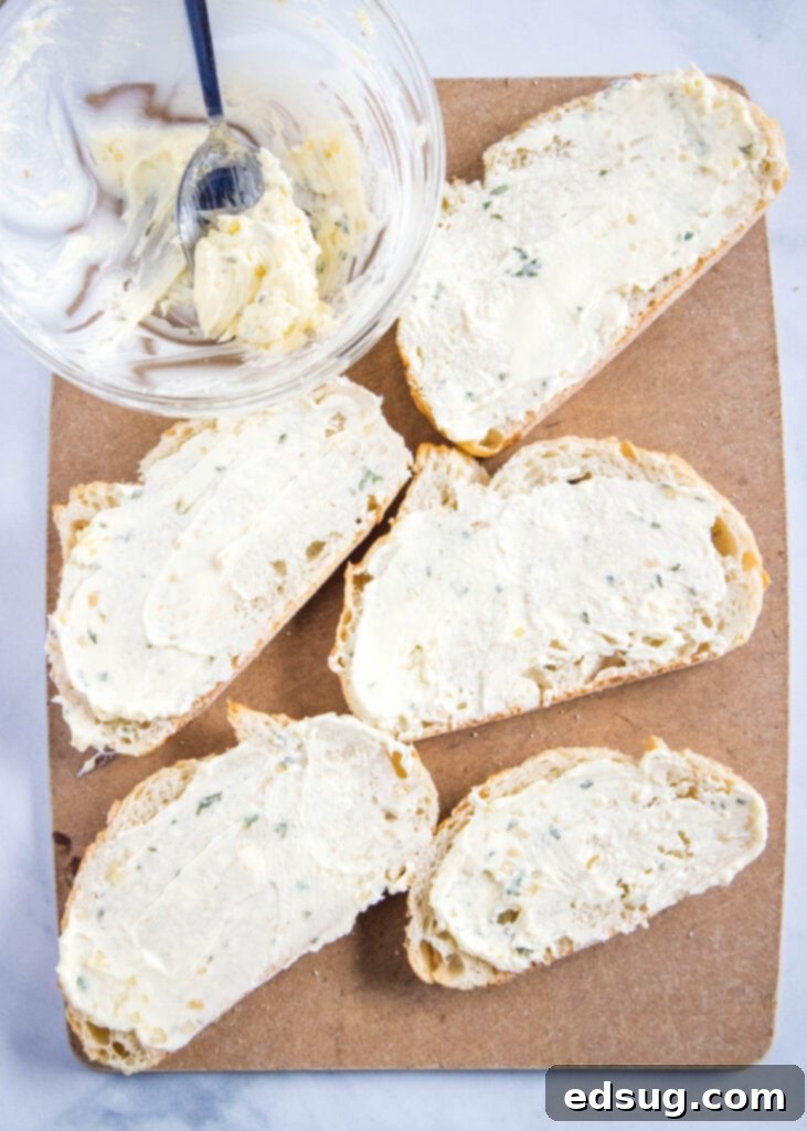 Crispy Air Fryer Garlic Bread 3 bread with garlic butter on a cutting board