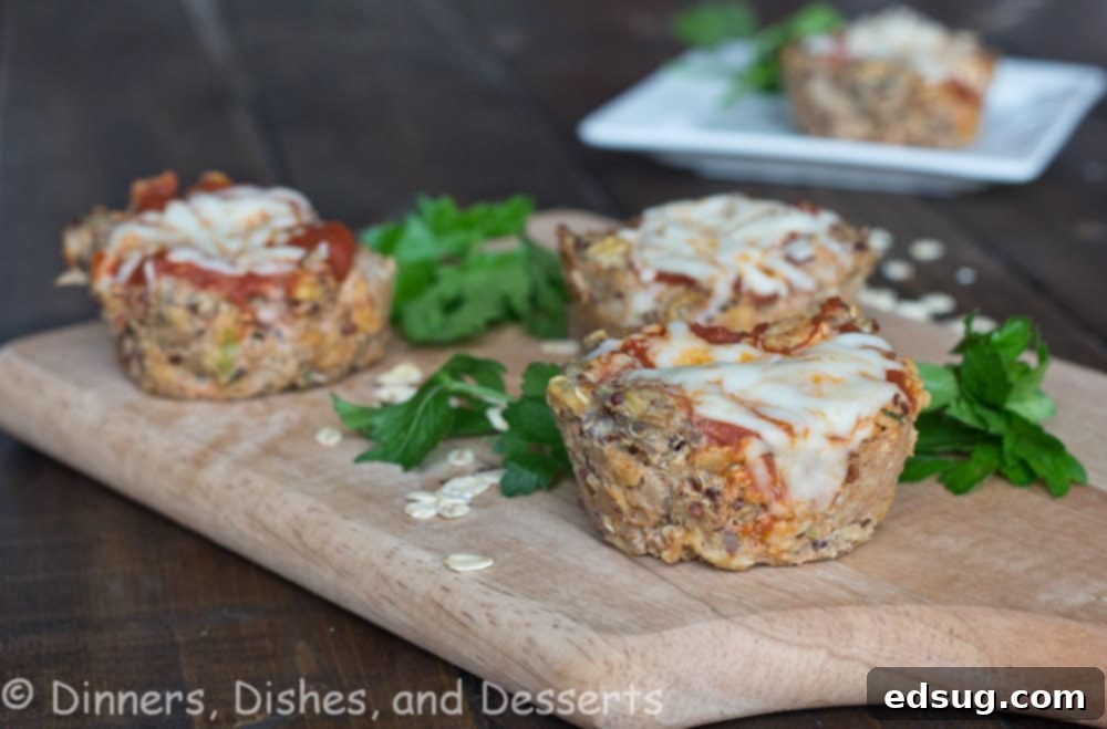 Close-up of Delicious Turkey Quinoa Muffin Cups A close-up view of turkey quinoa muffin cups in a muffin tin, topped with melted cheese and marinara, fresh out of the oven.