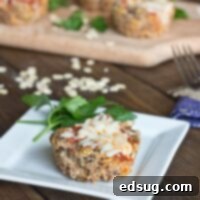 Savory Turkey Quinoa Muffin Cups 1 Close-up of a single turkey quinoa muffin cup with melted cheese and marinara.
