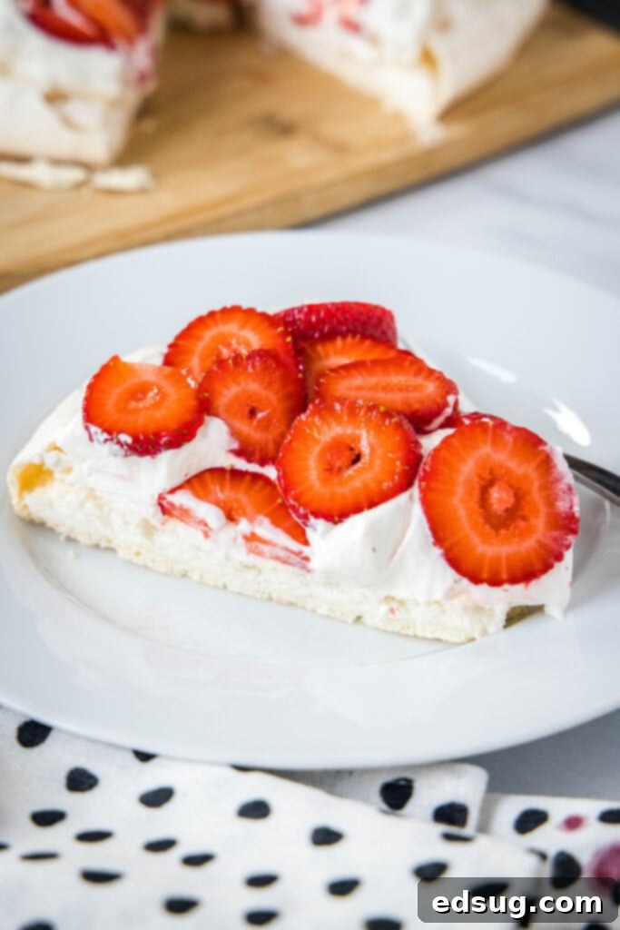 Perfect Pavlova 3 a slice of pavlova on a plate