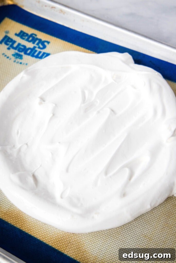 Perfect Pavlova 5 meringue on baking sheet ready for the oven