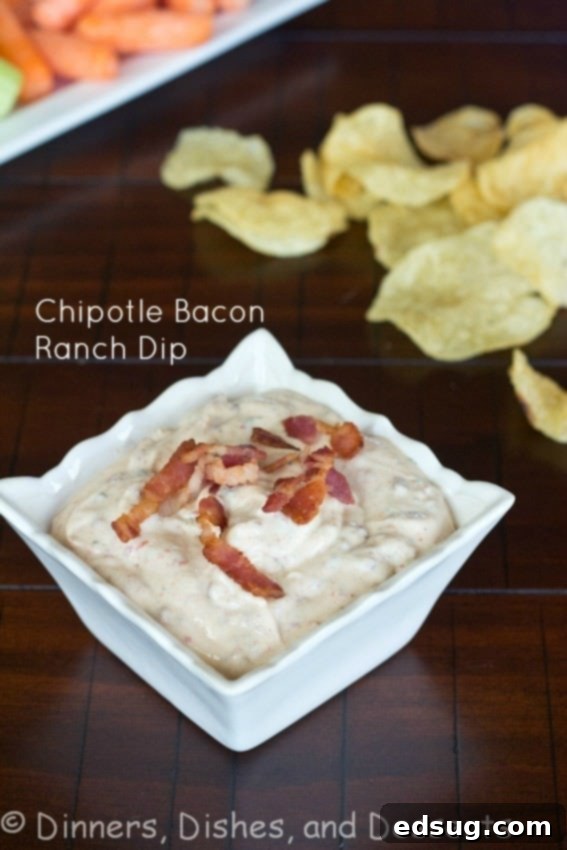 Chipotle Ranch Dip | @dinnersdishesdessert Creamy Chipotle Bacon Ranch Dip in a bowl, garnished with fresh herbs and crumbled bacon