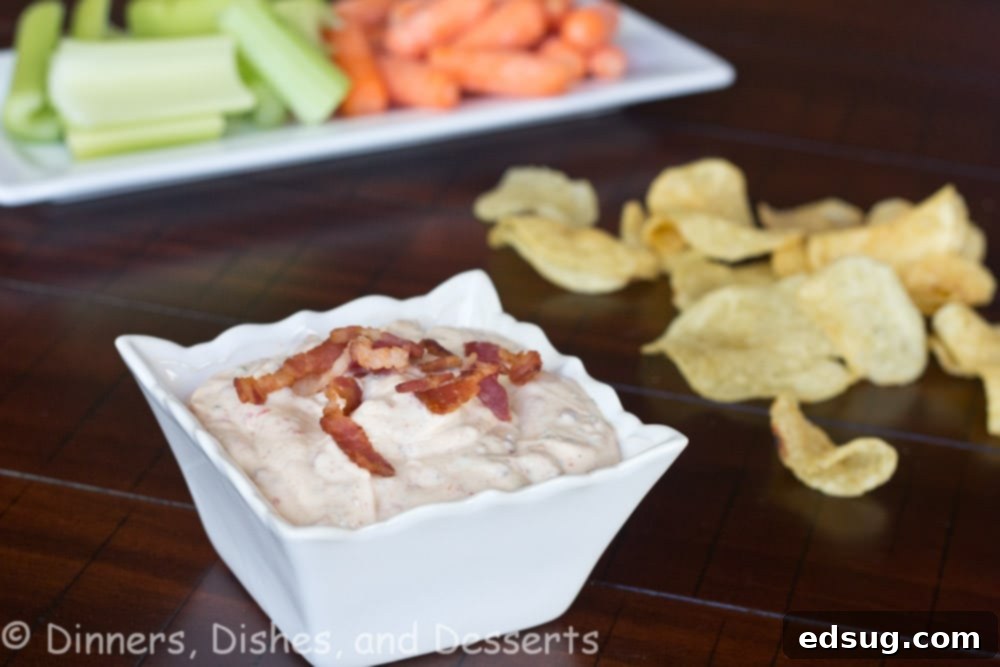 Chipotle Ranch Dip Close-up of creamy chipotle bacon ranch dip, showing texture and small pieces of bacon and seasoning