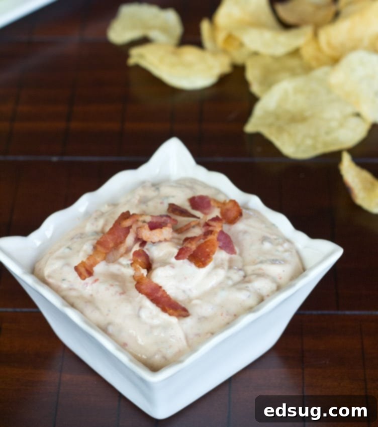 Chipotle Ranch Dip Chipotle Bacon Ranch Dip in a ceramic bowl with chips, ready to serve