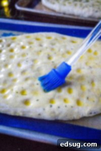 Aromatic Rosemary Focaccia 11 brushing oil on bread dough