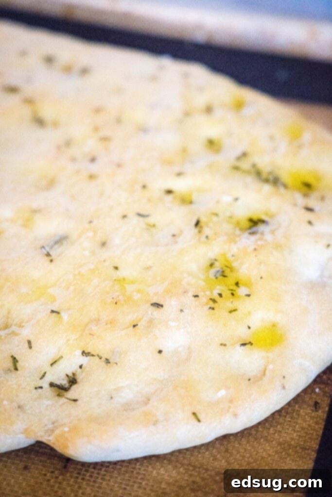 Aromatic Rosemary Focaccia 6 baked focaccia bread on baking sheet