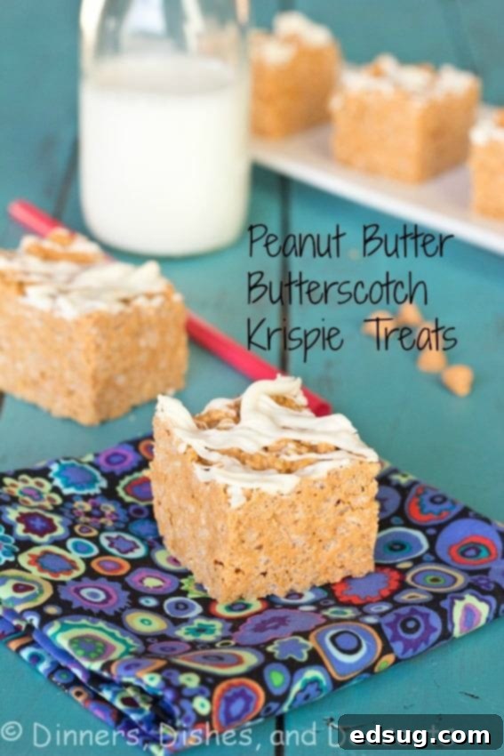 Peanut Butter Butterscotch Krispy Treats - A stack of fudgy no-bake bars on a white surface.