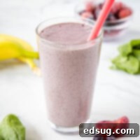 Berry Burst Smoothie 8 Close-up of a vibrant mixed berry smoothie in a clear glass