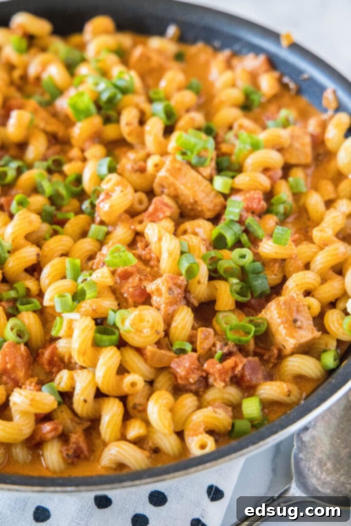large skillet of pasta with chicken and chorizo