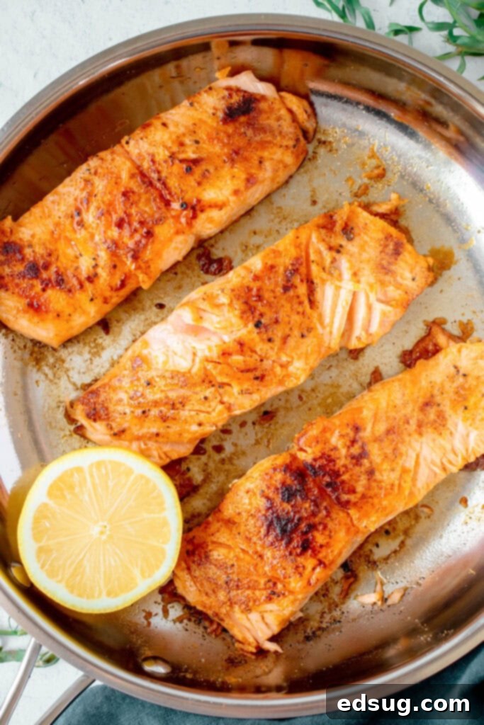 Seared Salmon Perfection 4 Salmon fillets seasoned and ready to be seared in a hot pan