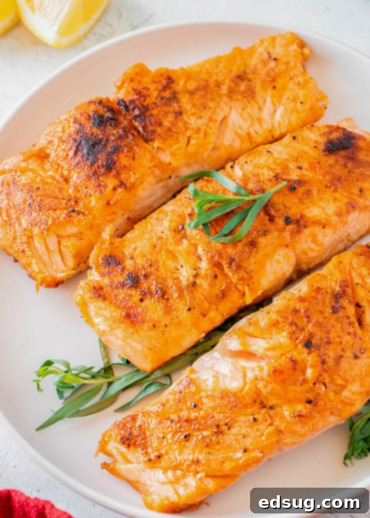 Seared Salmon Perfection 6 Close-up of perfectly cooked pan-seared salmon fillet on a white plate