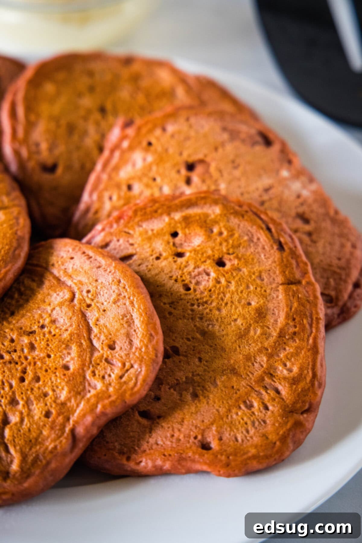Red Velvet Pancakes cooked red velvet pancakes on a plate