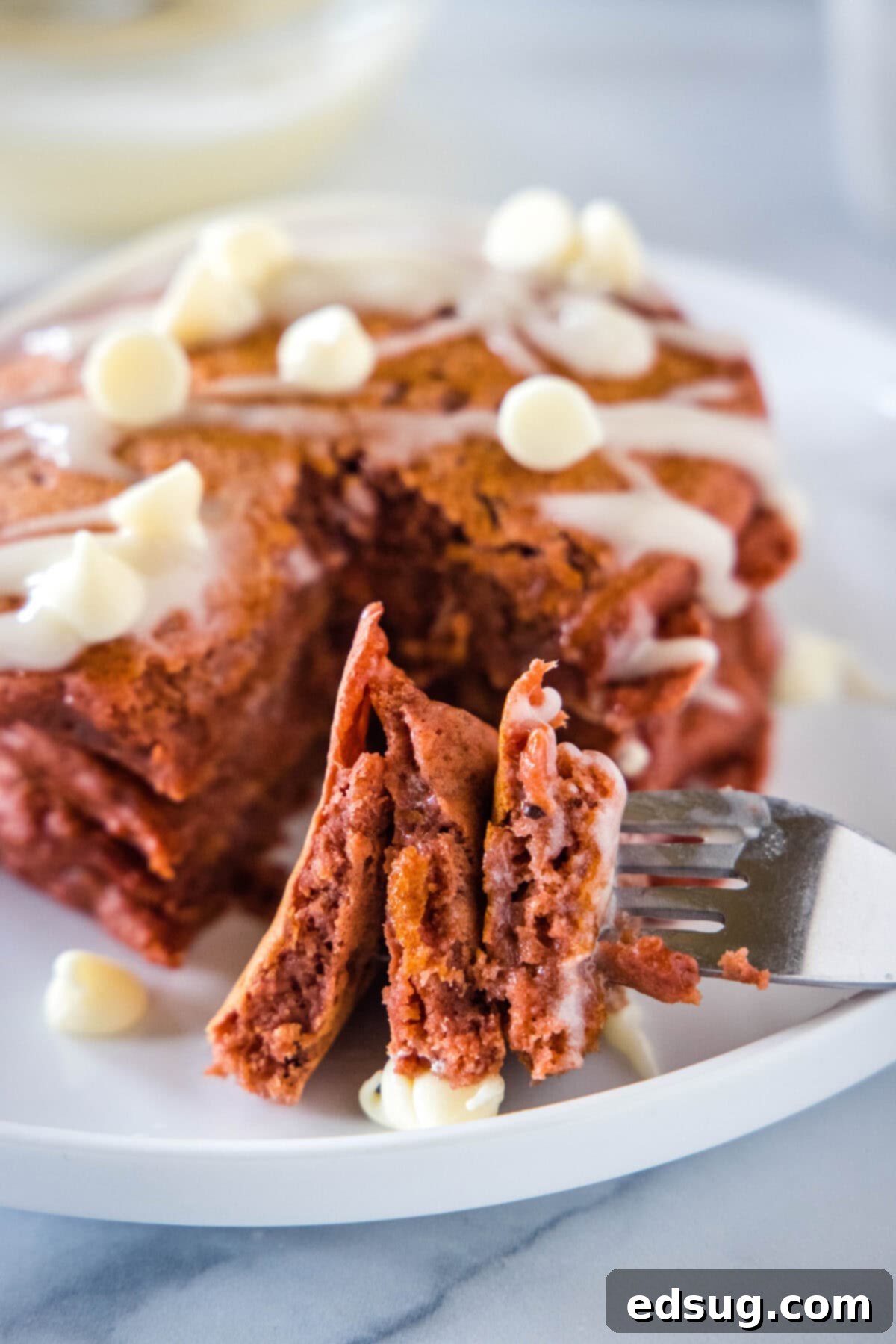 Decadent Red Velvet Pancakes 3 A bite of red velvet pancakes on a fork