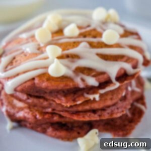 Decadent Red Velvet Pancakes 5 close up red velvet pancakes with cream cheese glaze