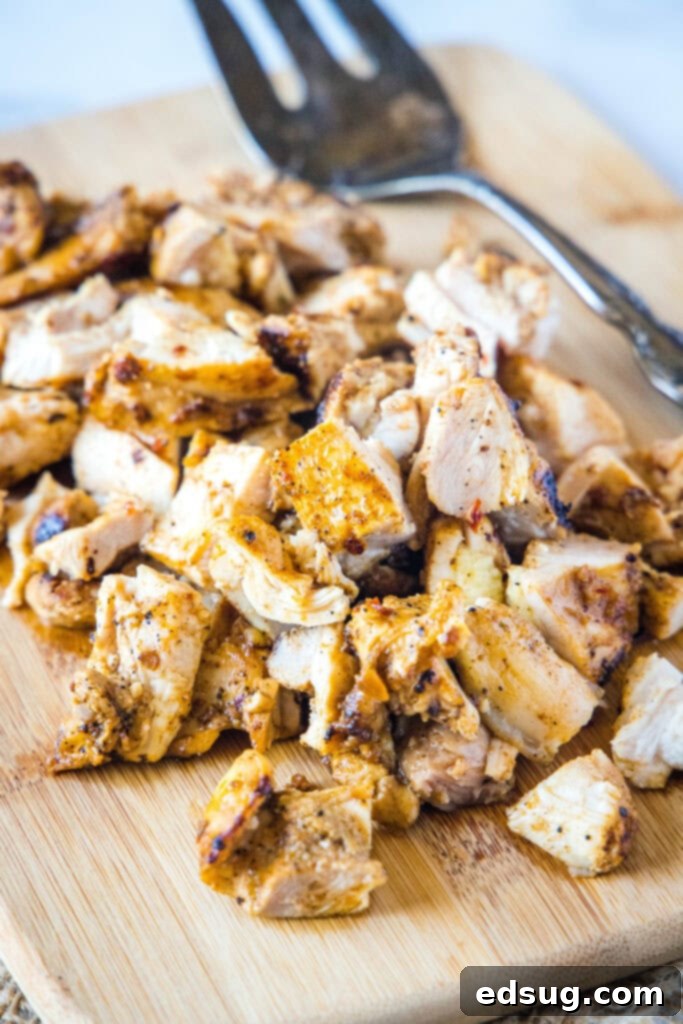 chopped chipotle chicken on a cutting board