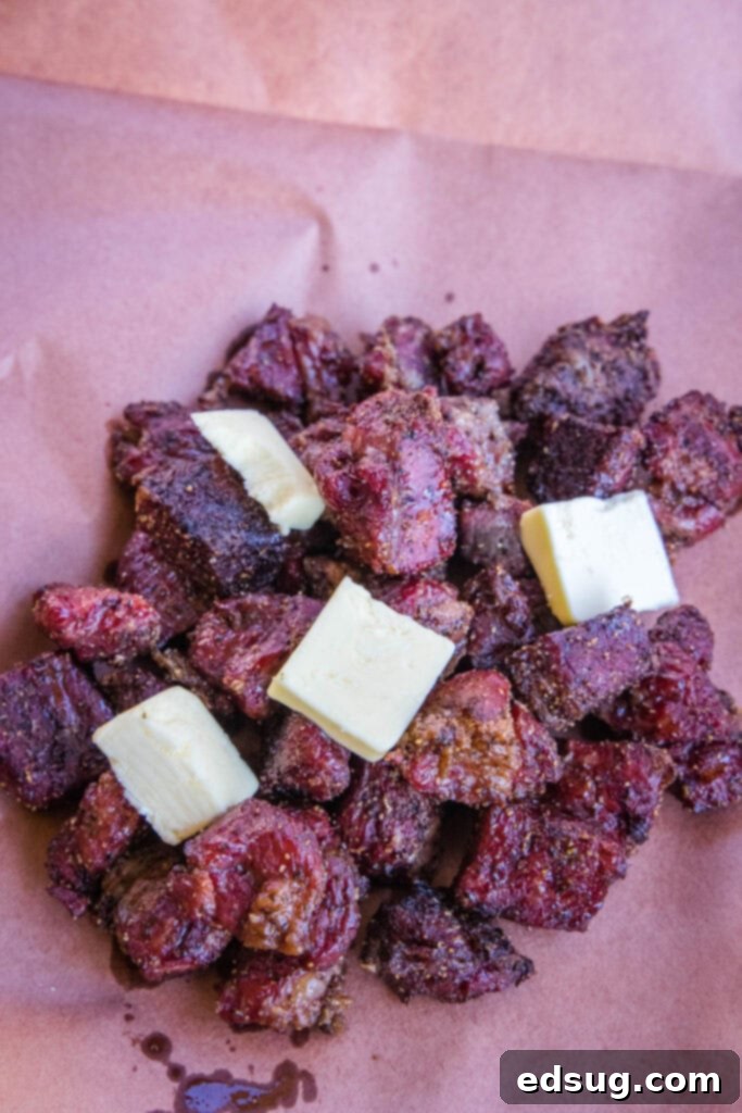 Burnt Ends on a Budget 4 Burnt ends getting wrapped in butcher paper with pats of butter on top before the final cook