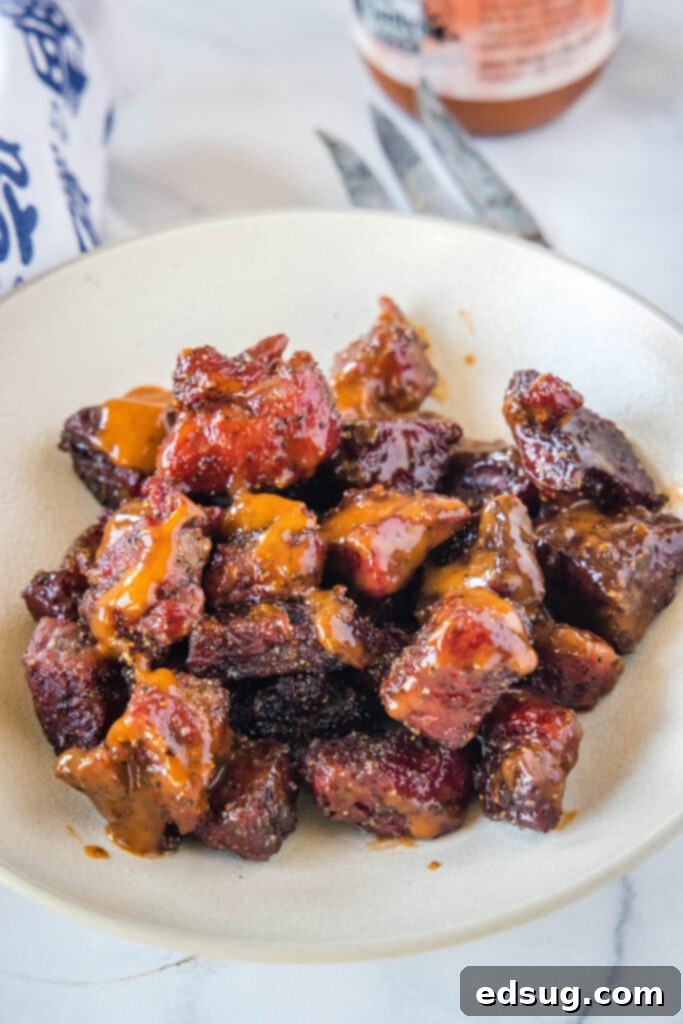 Burnt Ends on a Budget 5 Poor man's burnt ends served in a bowl, coated in barbecue sauce, ready to eat