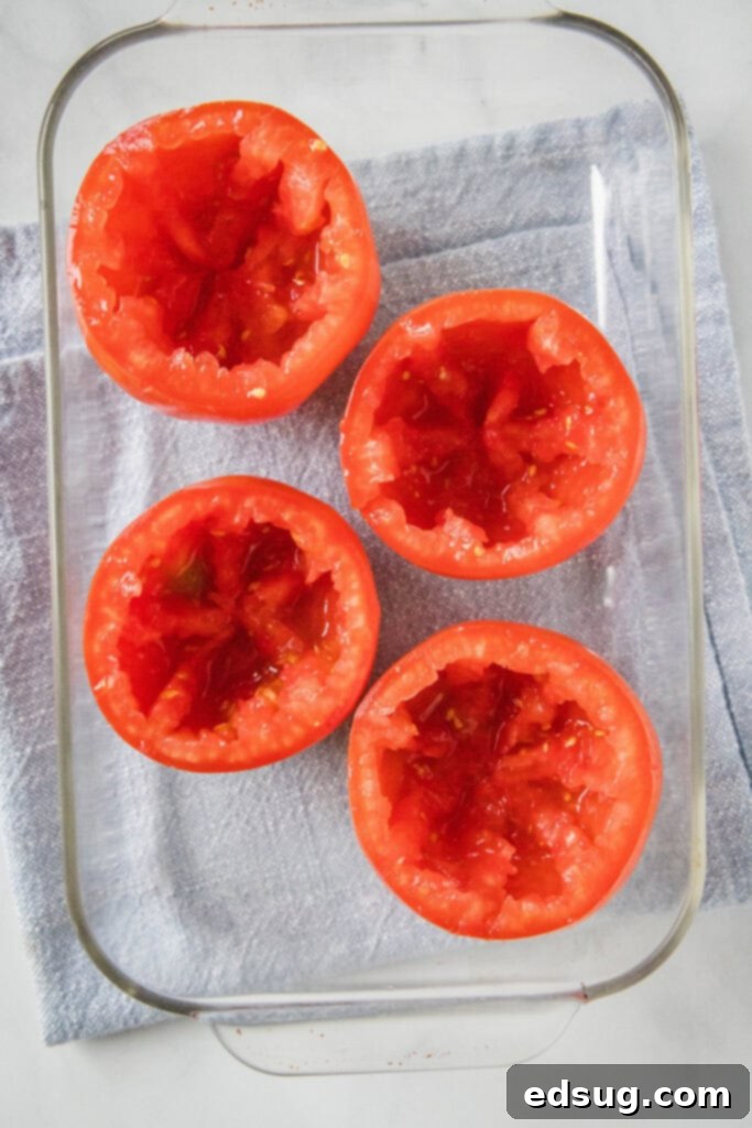 hollowed out tomatoes in baking dish