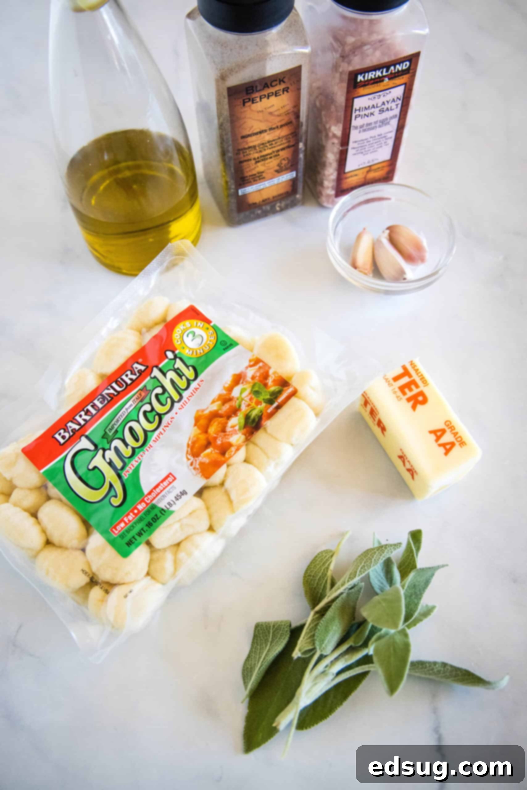 Make this quick weeknight brown butter gnocchi tossed in a rich, nutty browned butter sauce with sage. It's ready in 20 minutes! Fresh ingredients laid out for making brown butter gnocchi: gnocchi, butter, olive oil, garlic, and sage.