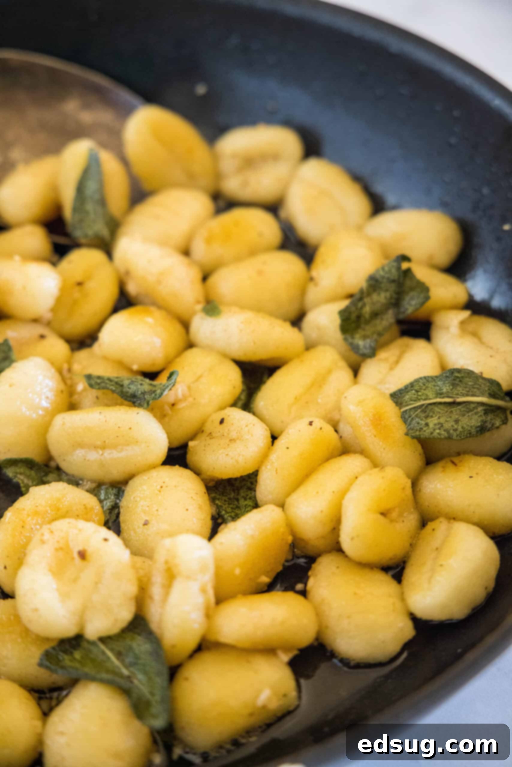 Make this quick weeknight brown butter gnocchi tossed in a rich, nutty browned butter sauce with sage. It's ready in 20 minutes! A generous portion of savory brown butter gnocchi with fresh sage leaves in a cast iron skillet, ready to be served.