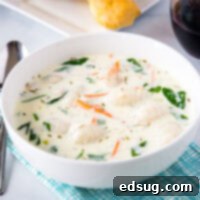 Velvety Chicken Gnocchi Soup 6 A bowl of soup on a table, with Olive Garden