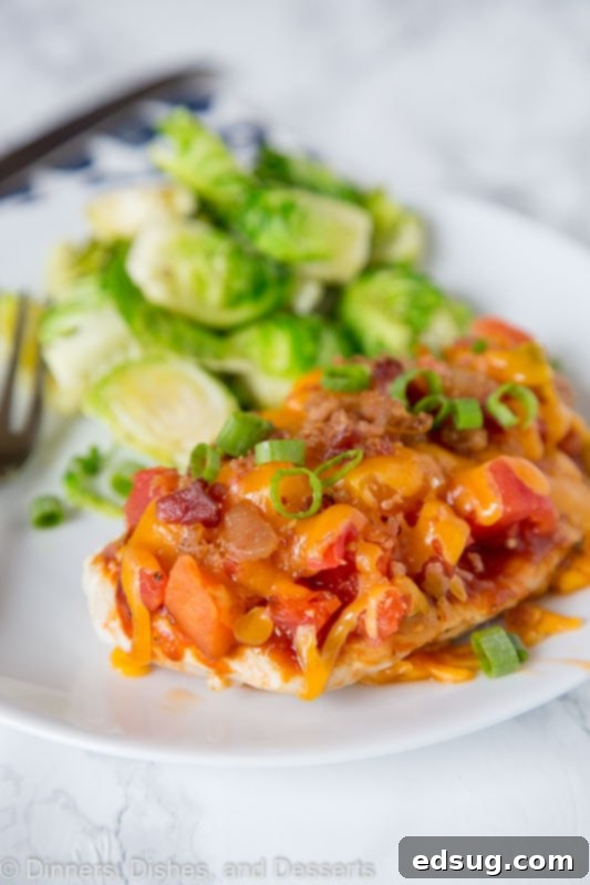 Loaded Monterey Chicken 3 A close up of raw chicken breasts seasoned with salt and pepper, ready to be cooked
