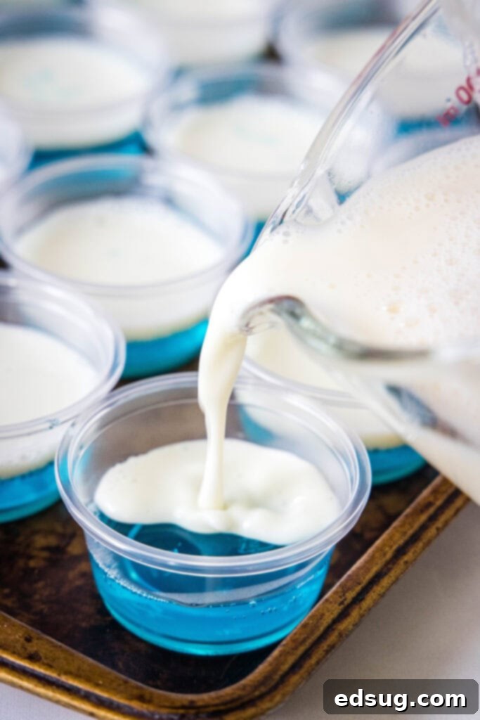 Patriotic Jello Shots 4 pouring white layer into jello shot cups