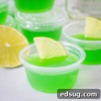 Tequila Lime Jiggle Shots 7 close up margarita jello shots with a slice of lime