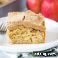 cropped in image of apple coffee cake on a plate with a fork