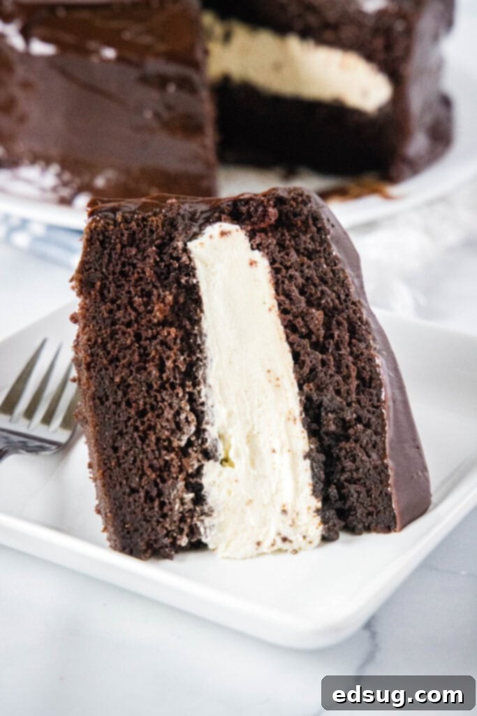 slice of ho ho cake on a white plate with a fork